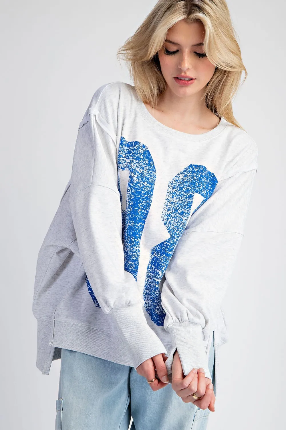 Faded varsity print long sleeve pullover top